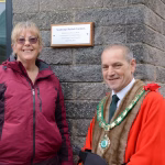 Photo of Councillor H. Parker & J. Hutchings with the Sunlounge Plaque.