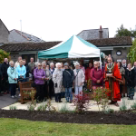 Photo of those in attendance at the Grand opening of the Sunlounge, Badock Gardens.